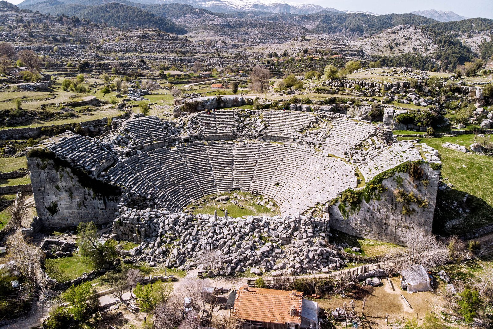 Ancient city of Selge near Belek, Antalya — mountain amphitheater and ruins surrounded by Mediterranean forest.
